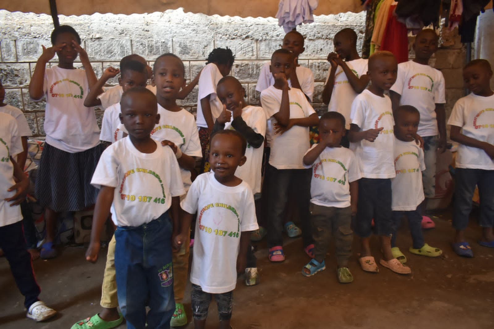 Children at Great Hope Child Home, giving thumbs-up during an S.I.P visit
